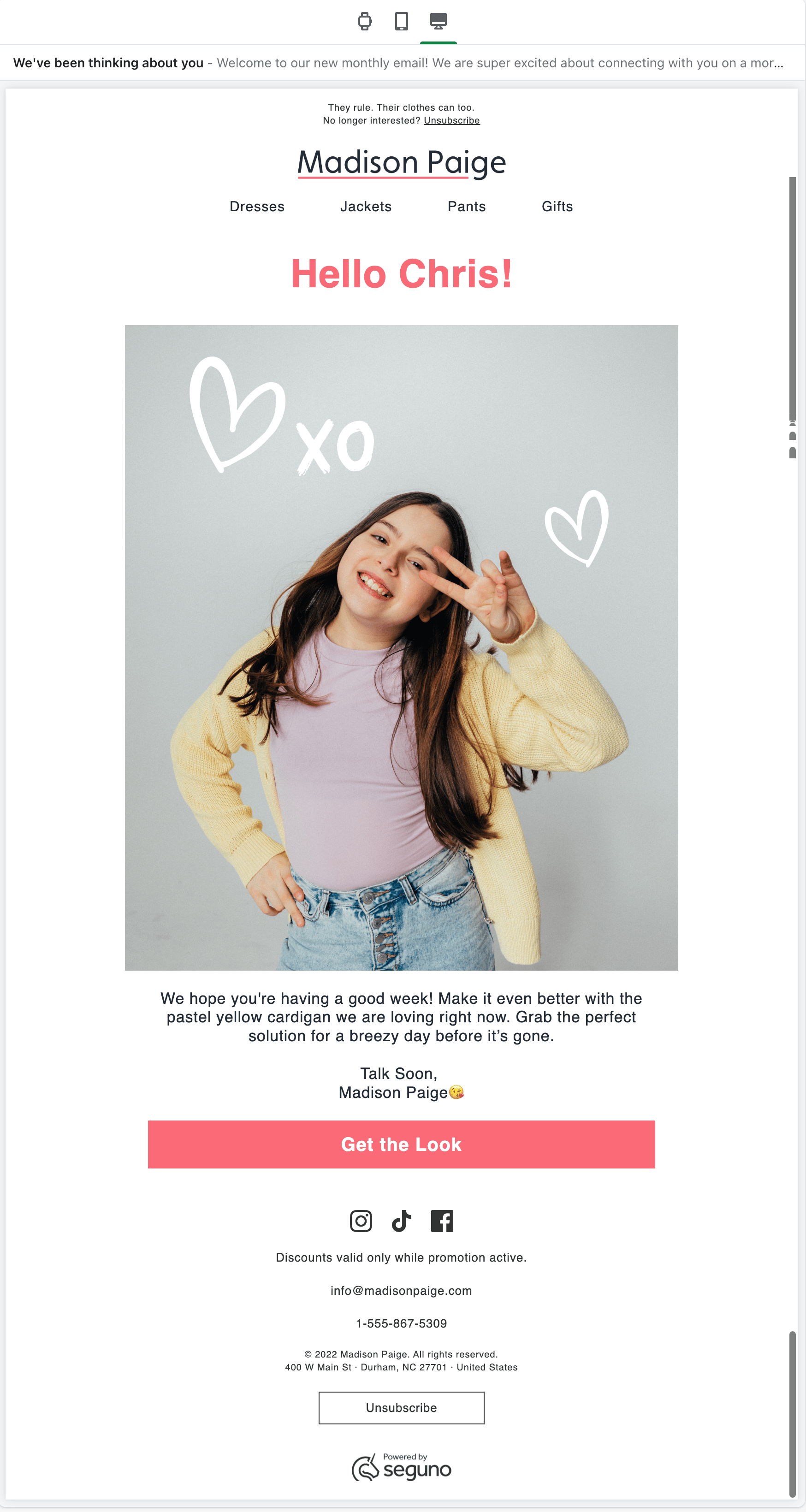 Email featuring a girl holding up two fingers as a peace sign, and accompanying text promoting the cardigan she's wearing