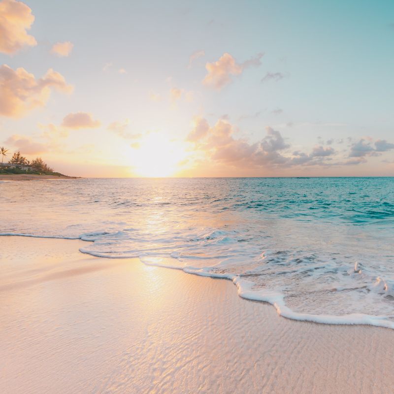 A beautiful beach during sunset.