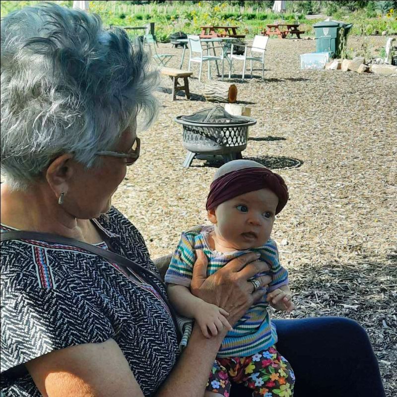 Older person holding a baby