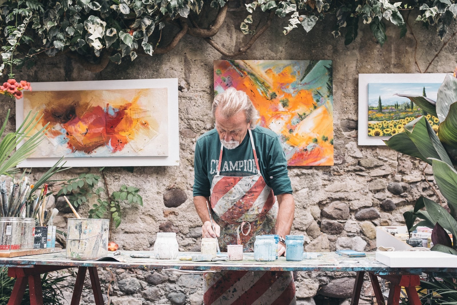 elderly man working on pottery