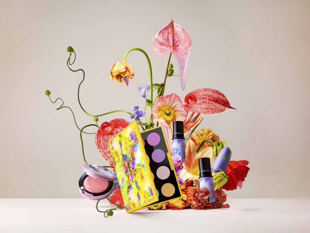 Arrangement of flowers and Mac products