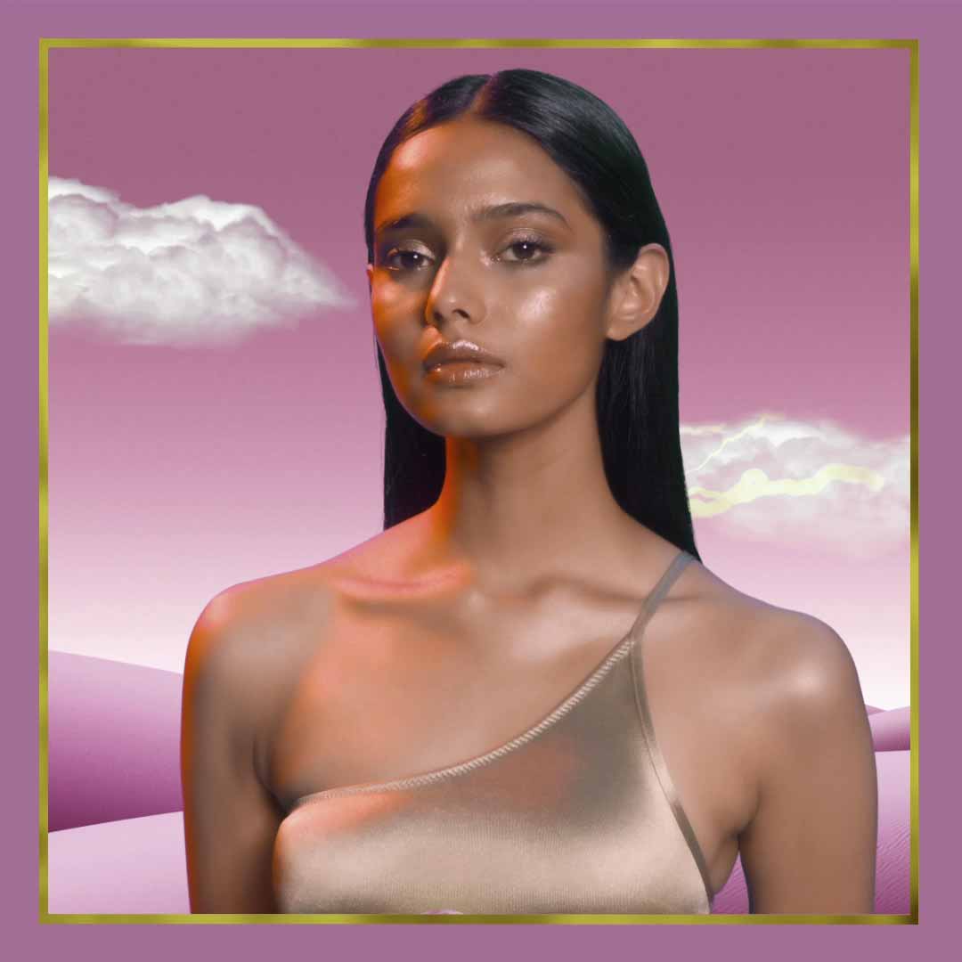 Bronzer model against surreal purple landscape