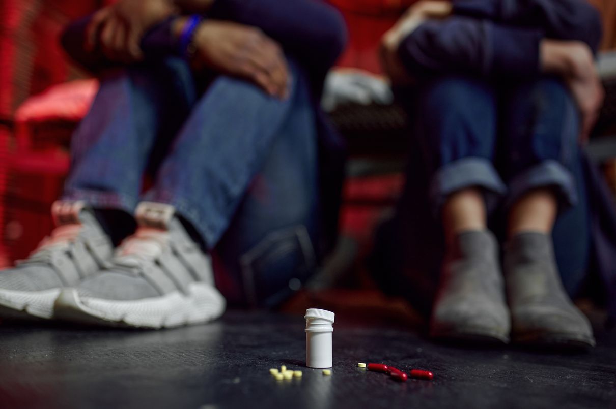 two person addicted to different substance, one is with yellow xanax
