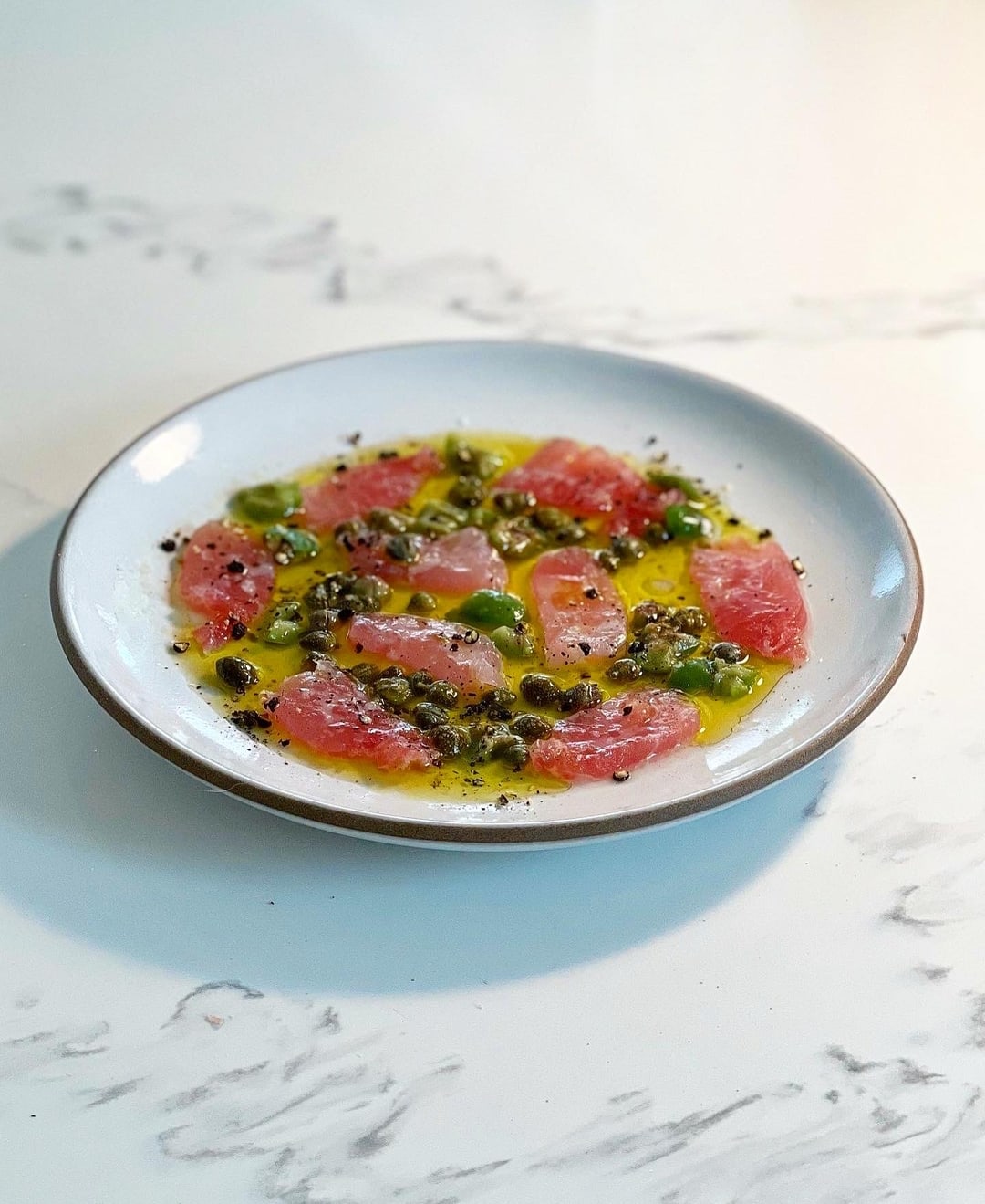 tuna crudo with capers and olives