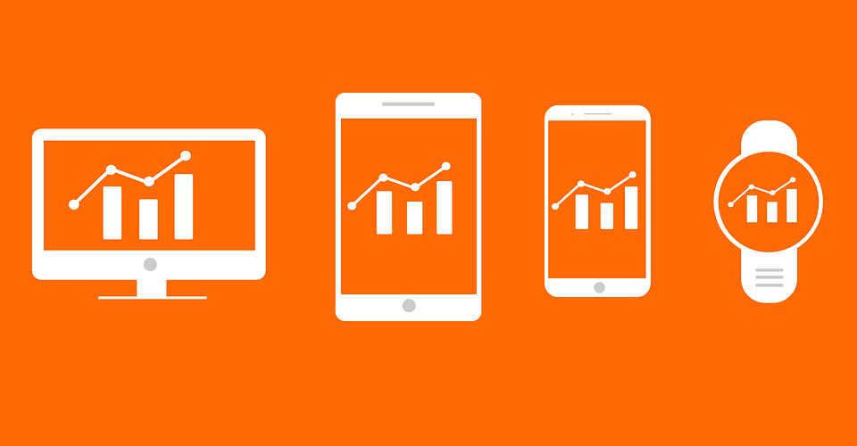 electronics on orange background