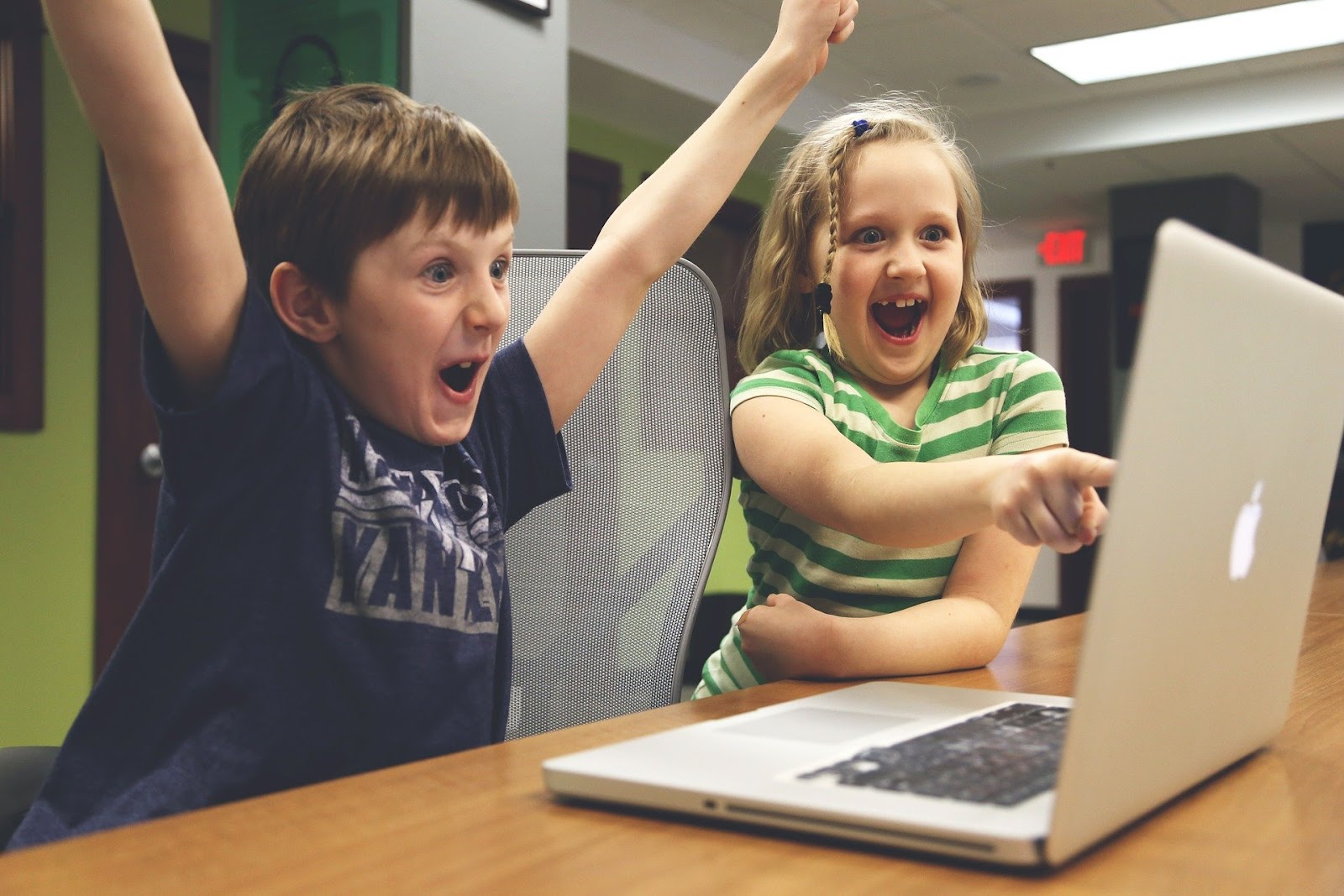 kids looking at laptop screen