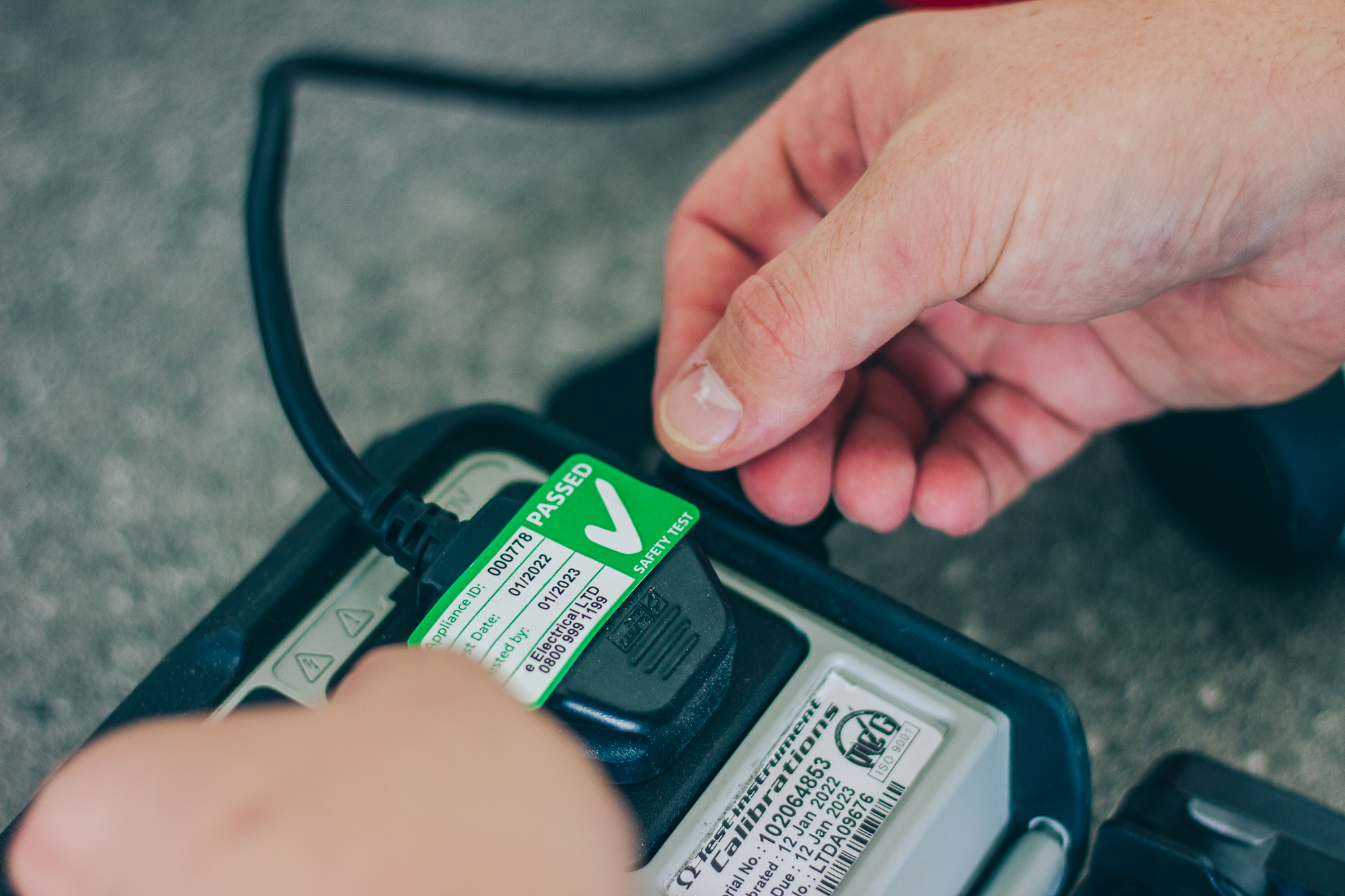 PAT testing sticker on plug