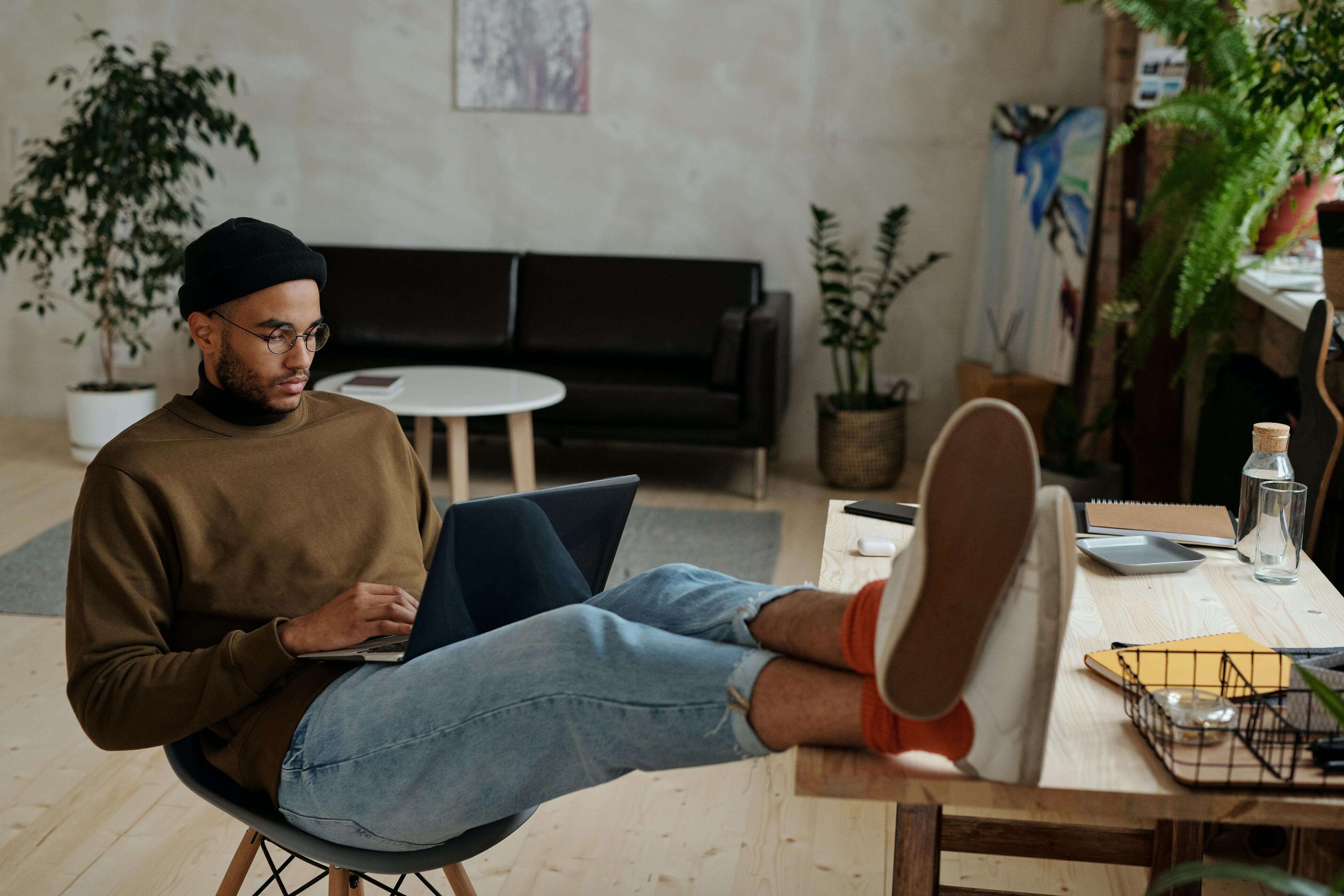 A man using selling software on his laptop