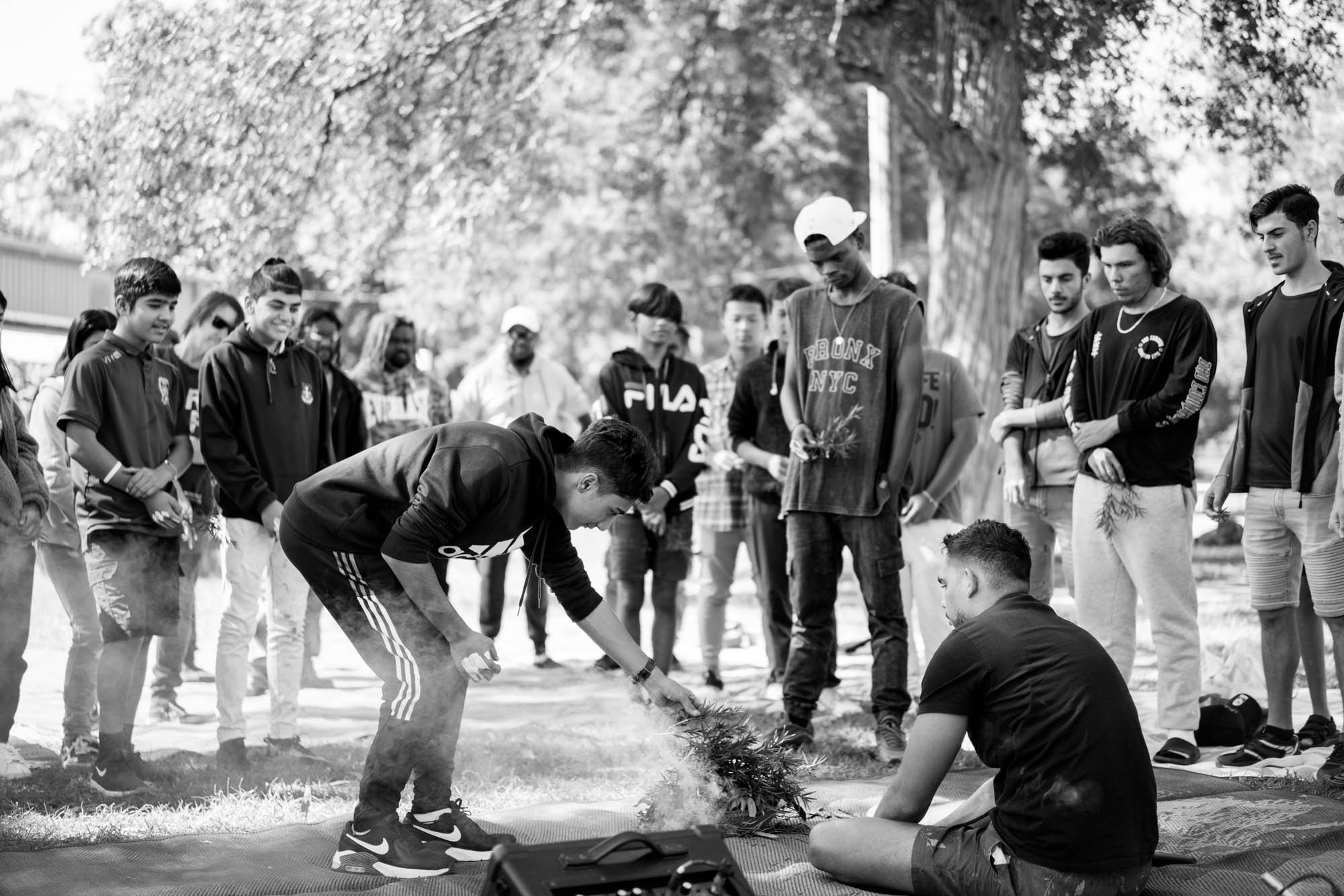group of youths during a smoking ceremony