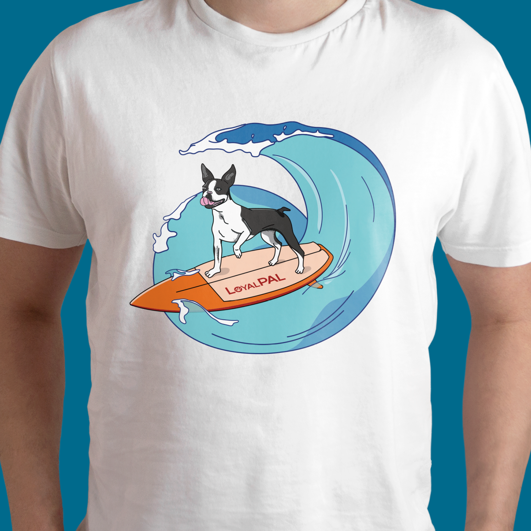 A white t-shirt mockup with a colourful print on a illustration of a happy boston terrier dog with his tongue out surfing on an orange surfboard. Riding the waves.