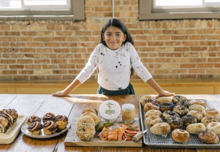Girl behind pastries