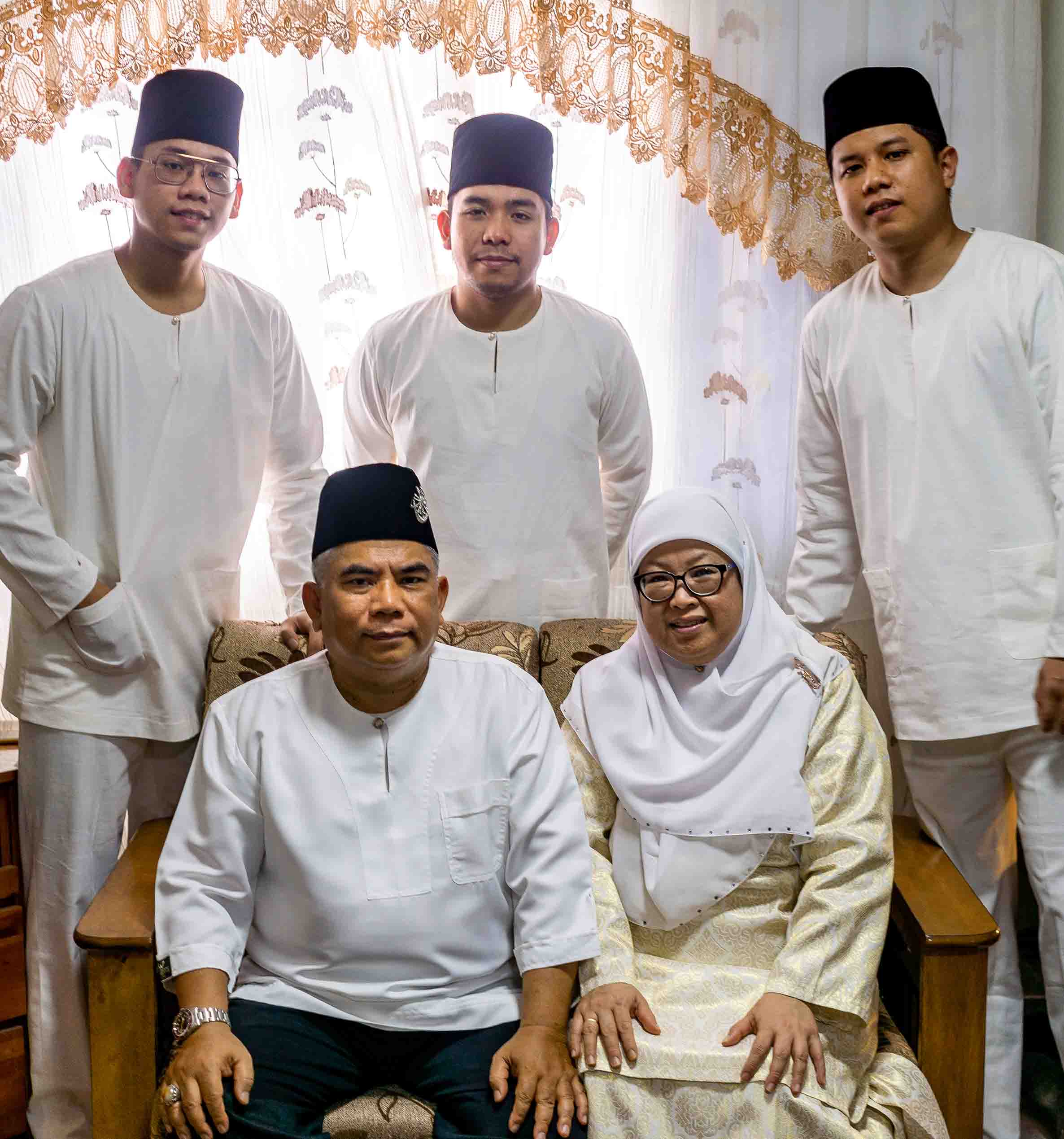 Matin's family photo during Hari Raya, featuring his two brothers and mum and dad.