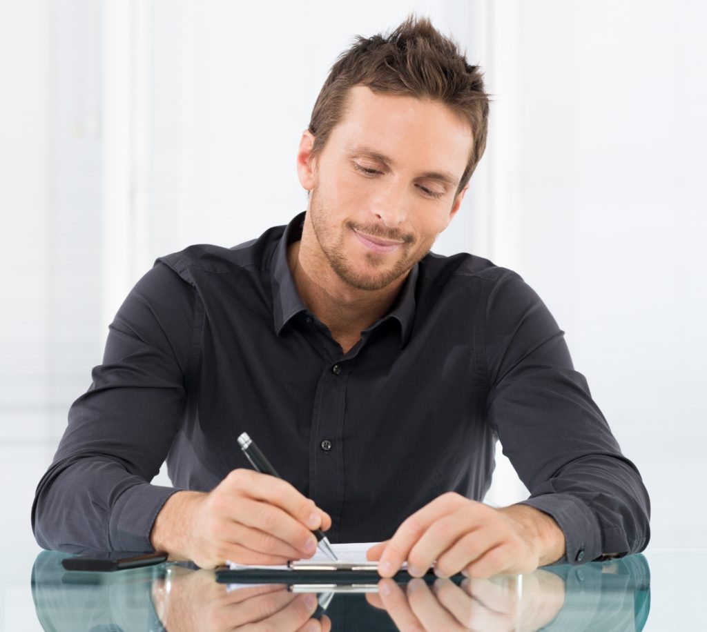 Businessman Writing Document