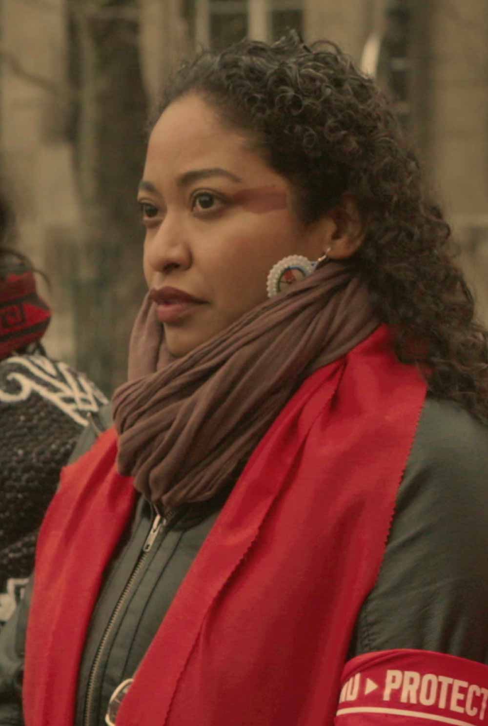 A first nations woman protests at COP21 in Paris.