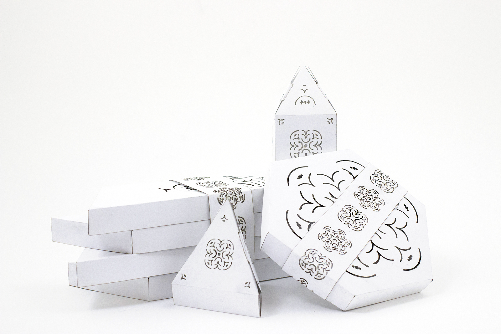 All candle packaging, stacked.