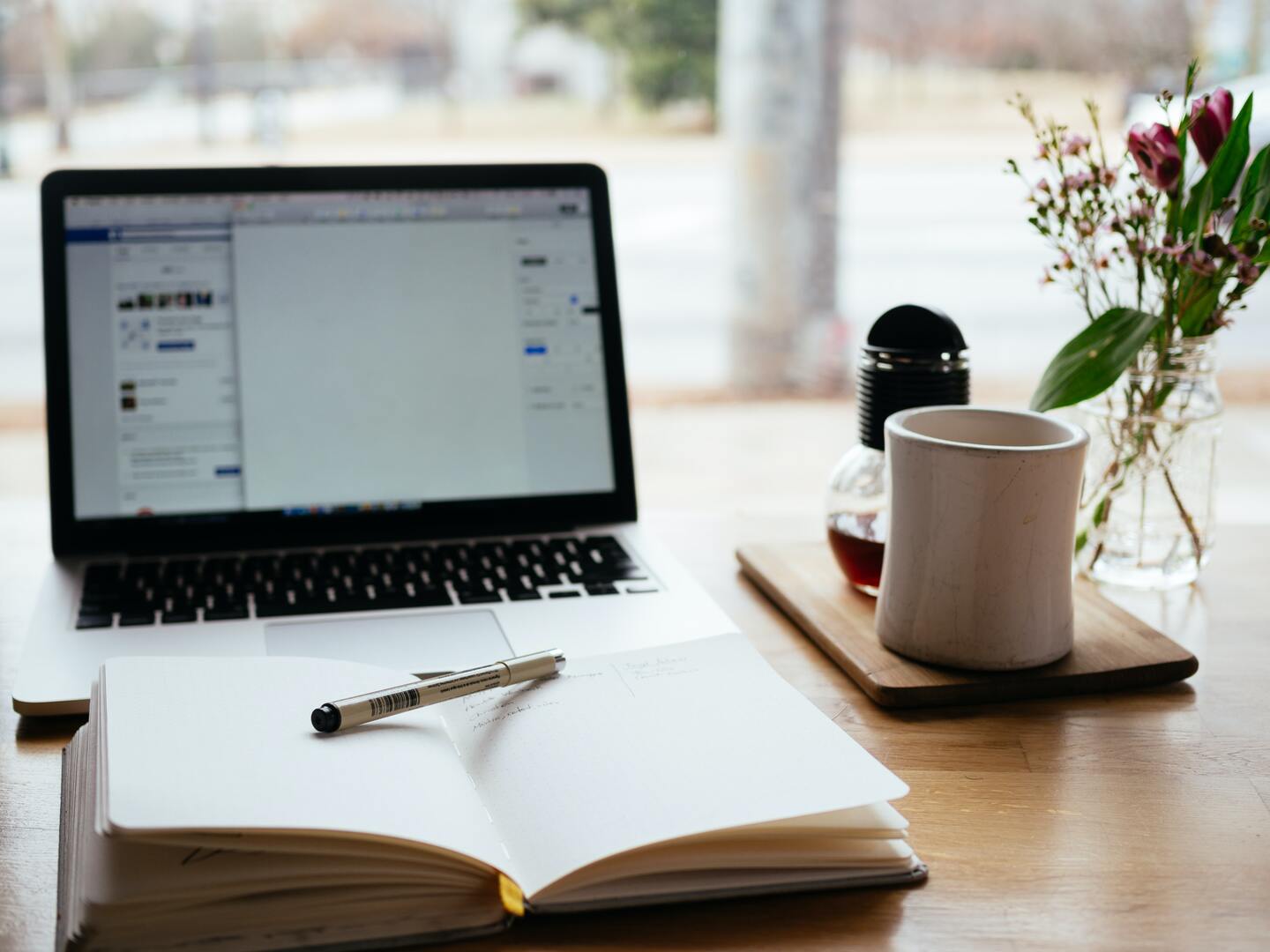 laptop-open-notebook-on-table