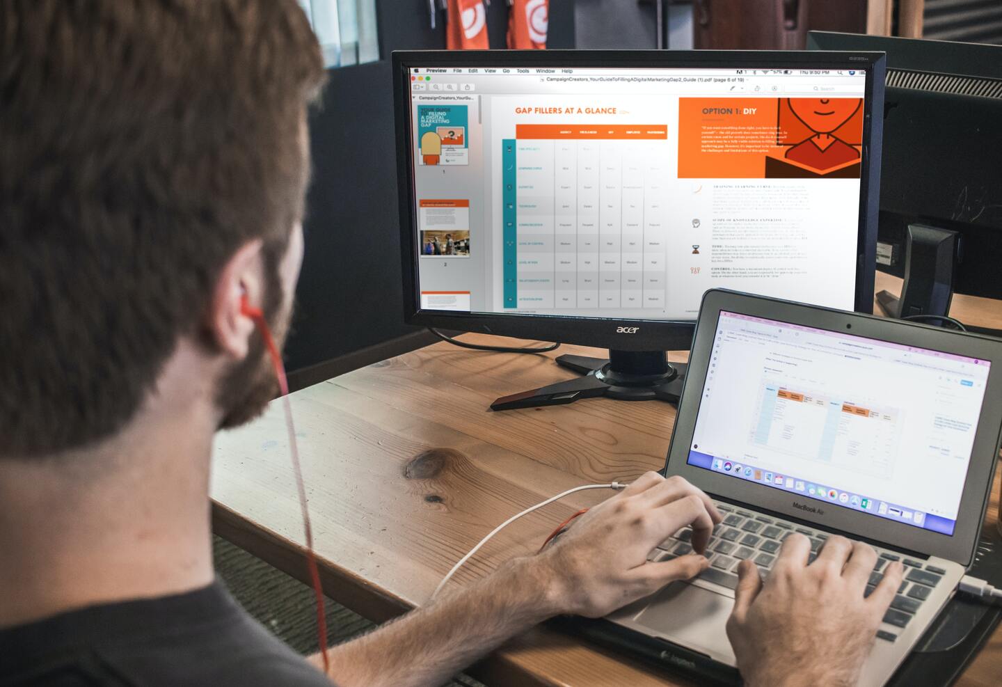 person-working-on-laptop-and-PC