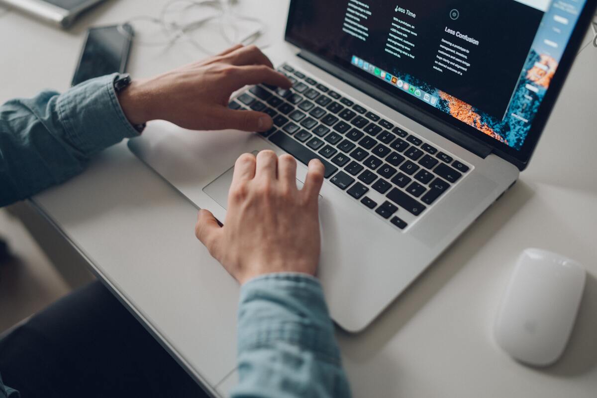 person-typing-on-laptop-on-table
