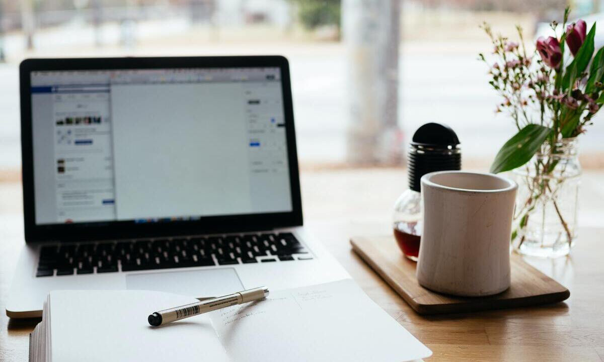 laptop-notebook-mug-pen-on-desktop