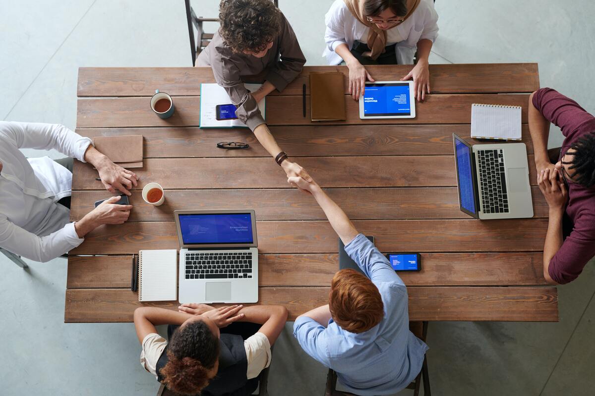 office-coworkers-shaking-hands-during-meeting