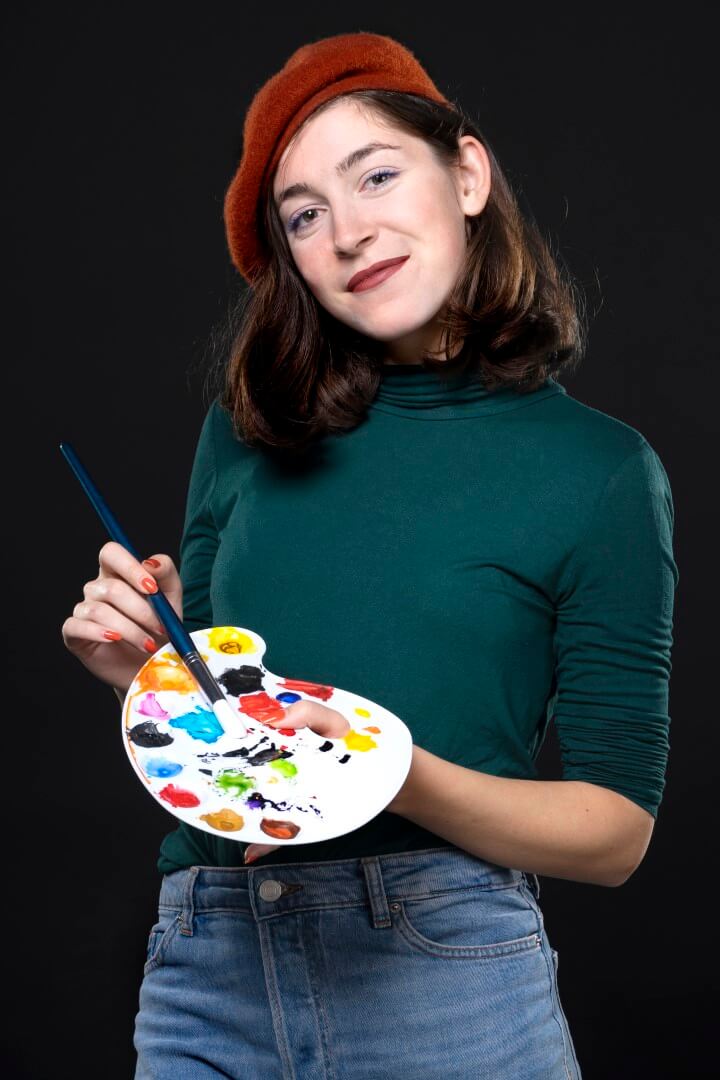 Photo of Emilia with paint brush