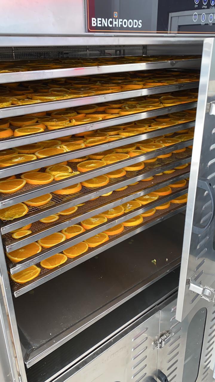 Benchfoods Dehydrator doing a A batch of oranges to be stored for locals