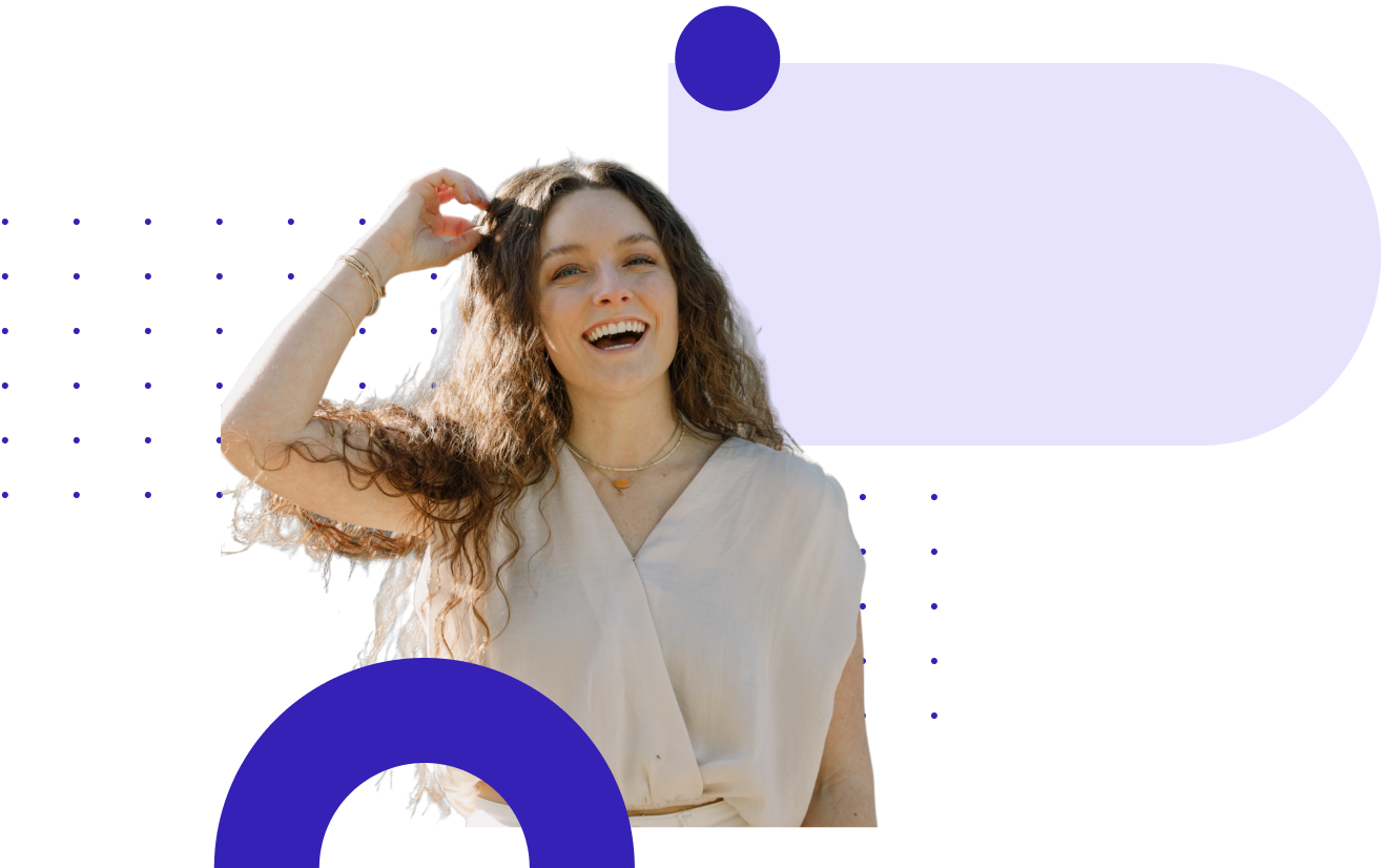 Woman smiling with hand in hair