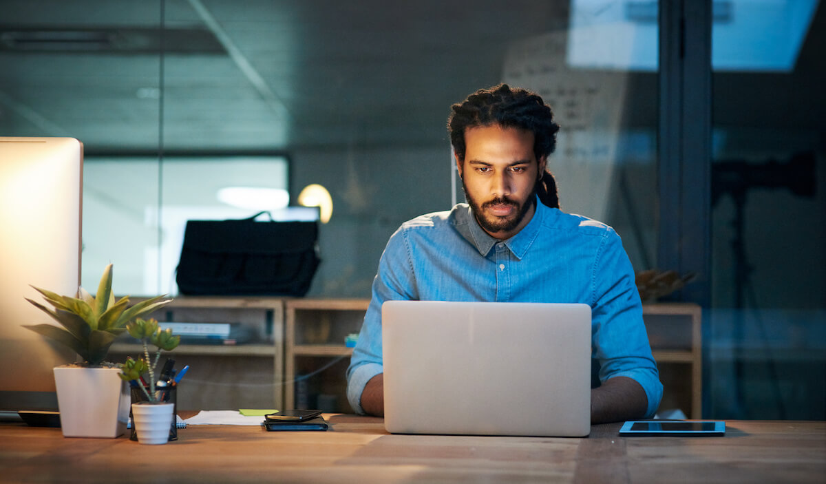 No motivation to work: serious man working at an office