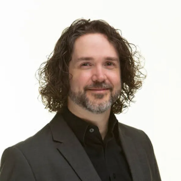 A photograph of Jordan Szymczyk.