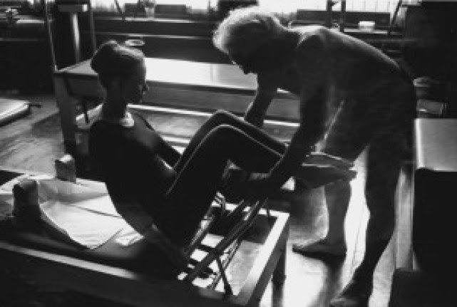 PLATE 26A student on reformer