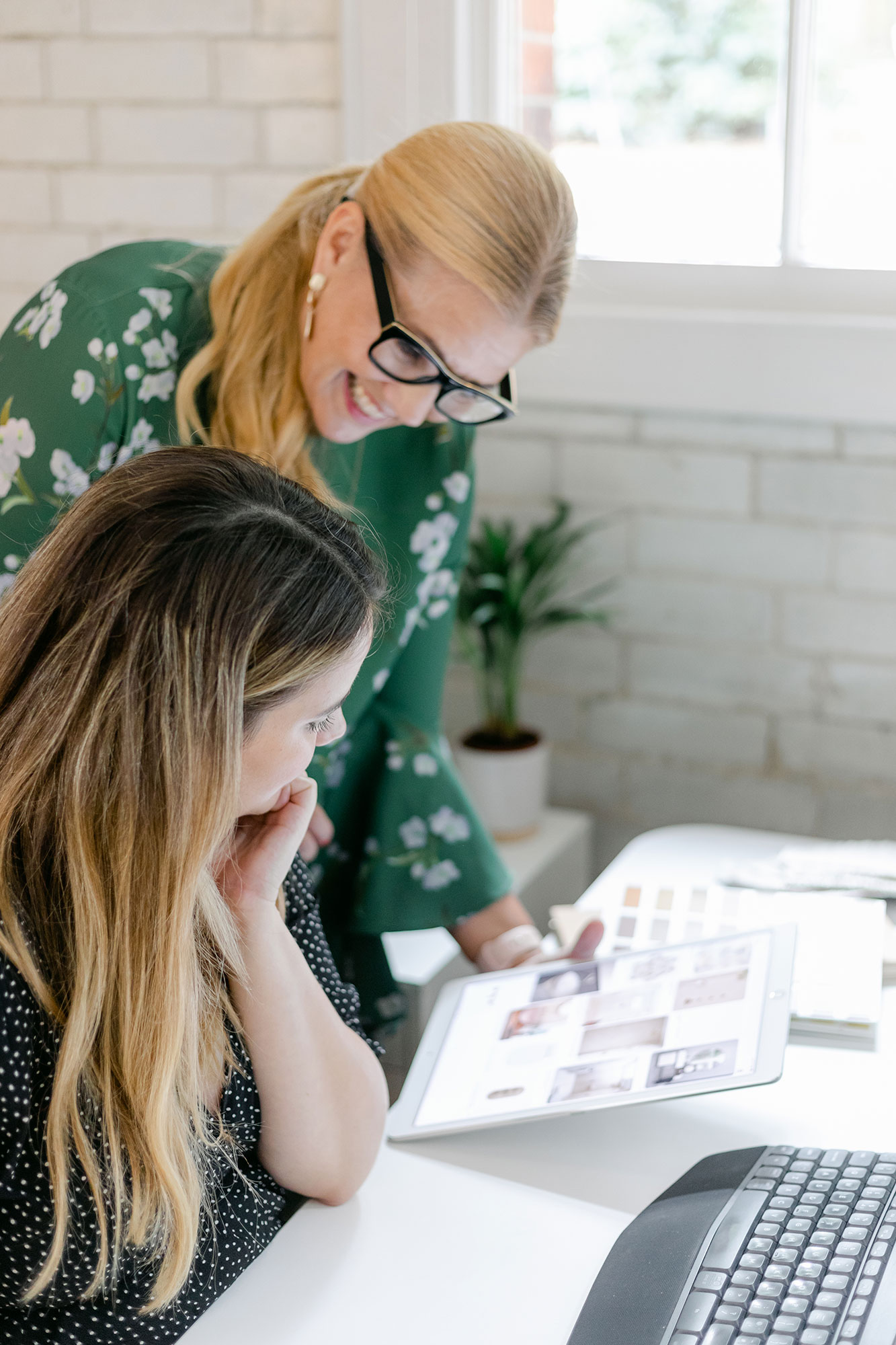 two designers reviewing work
