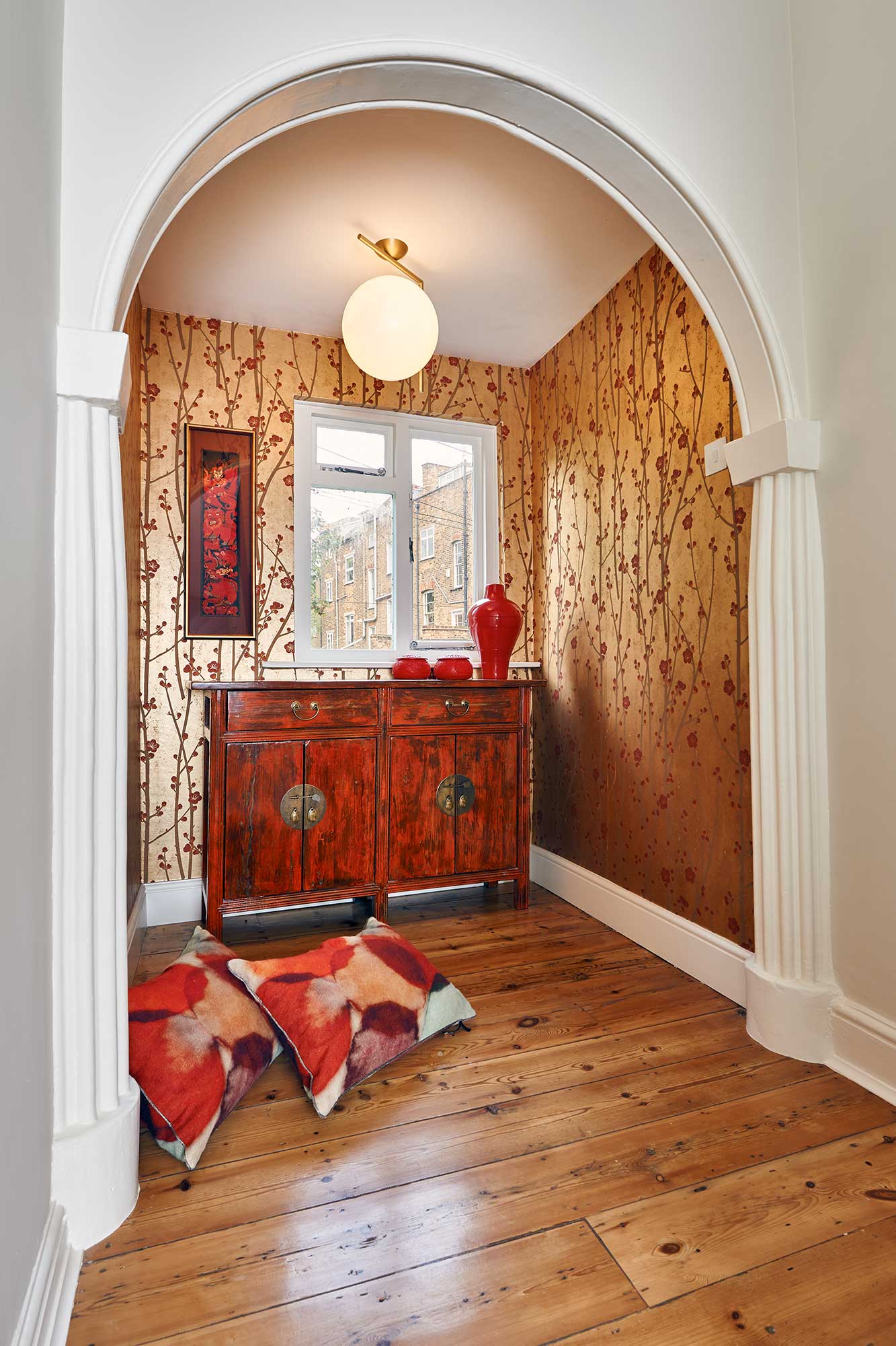 traditional landing area with dark wood console table