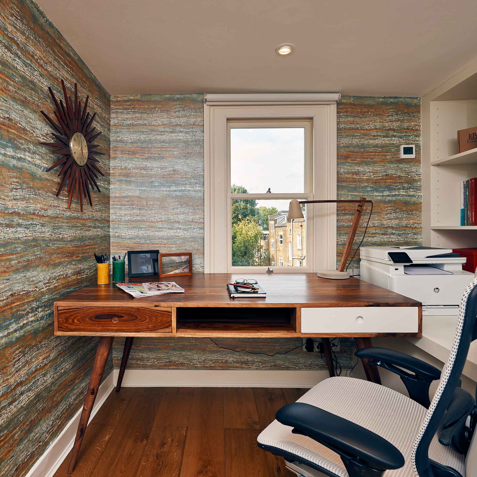 home office with dark wood desk