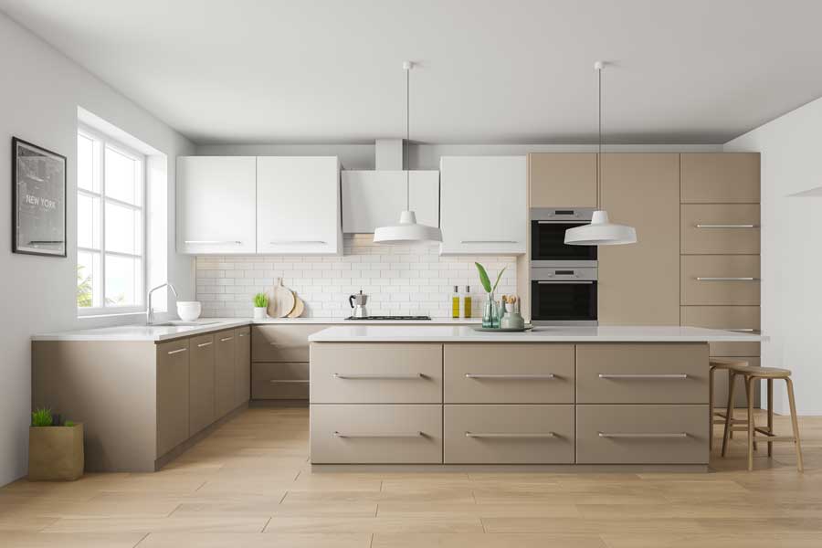 Modern, white kitchen with beige cabinets.