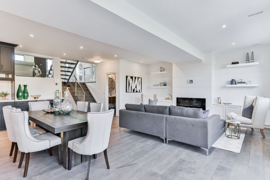 White living room with gray tile floors.