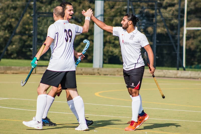 Two men celebrating a goal