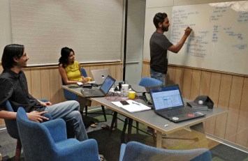 Locale team writing in a white board.