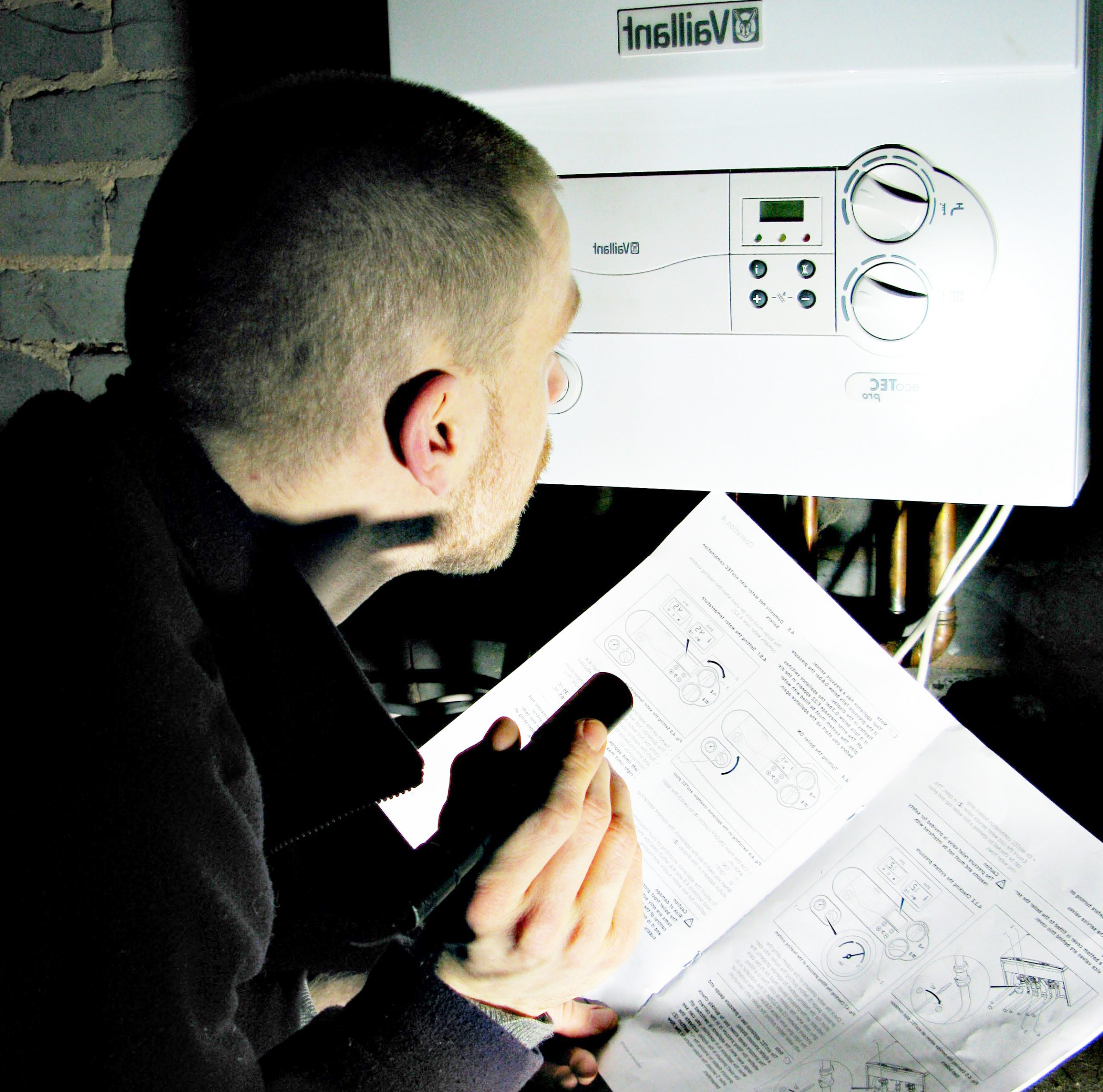man checking the heater