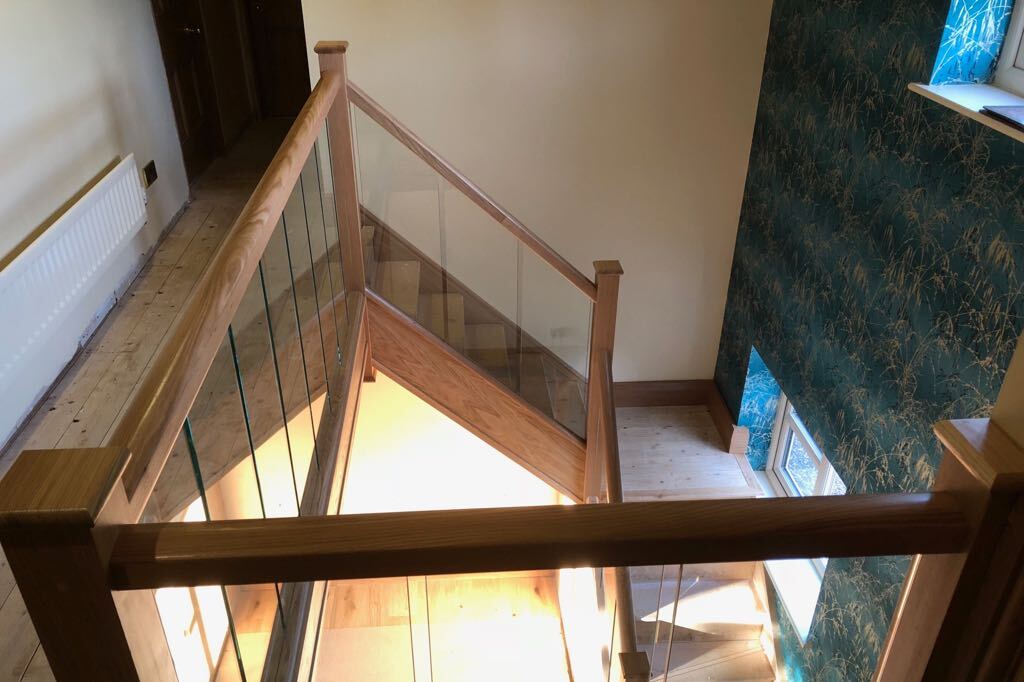 Solid Oak Staircase With Seamless Glass Balustrade And Galleried 