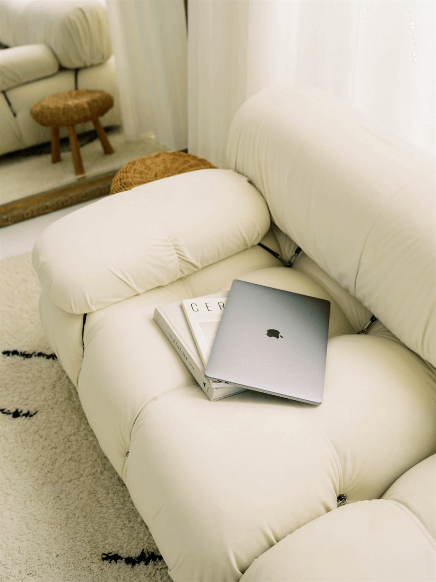 A laptop sitting on the couch at Mariko Studio