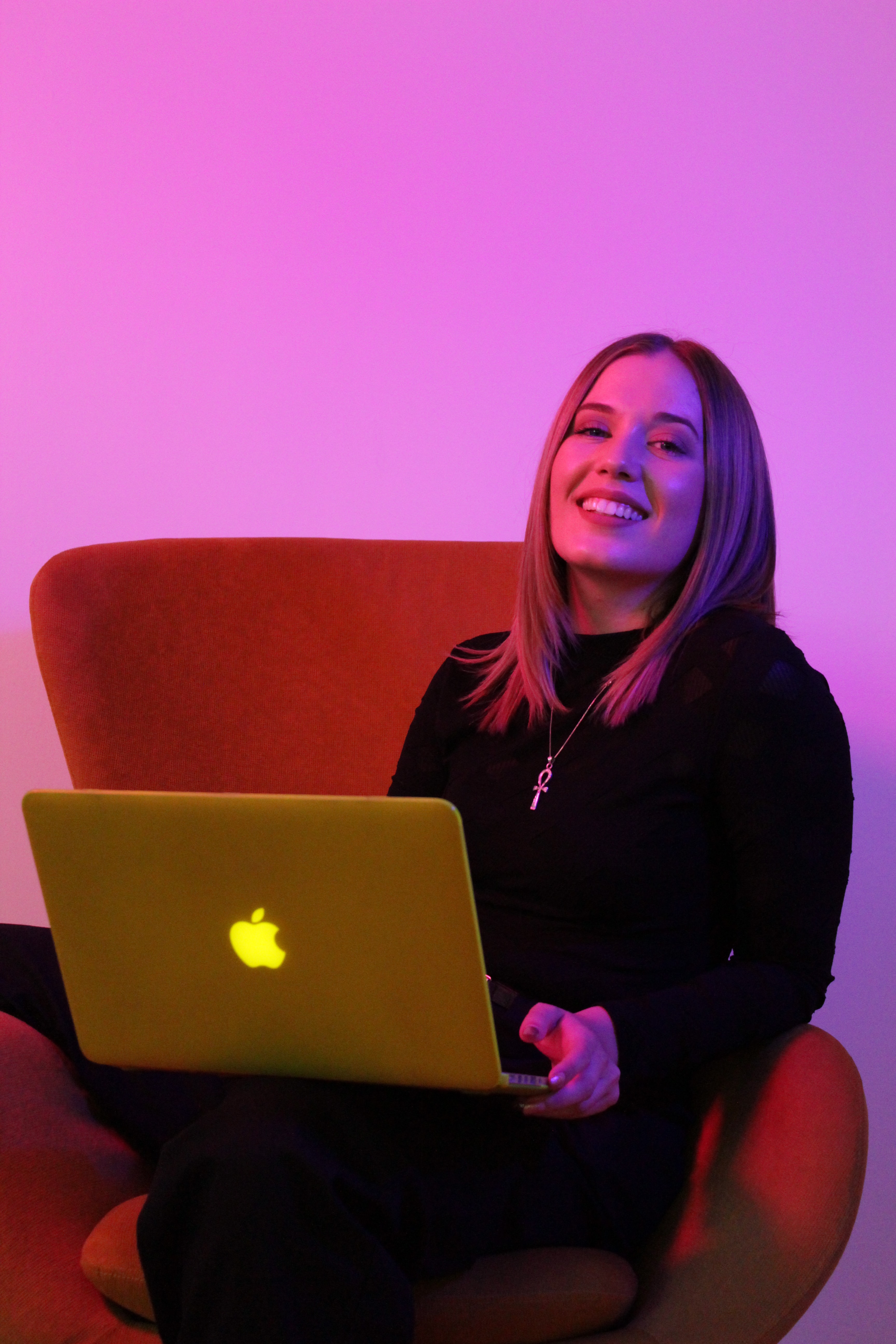 smiling girl with macbook laptop