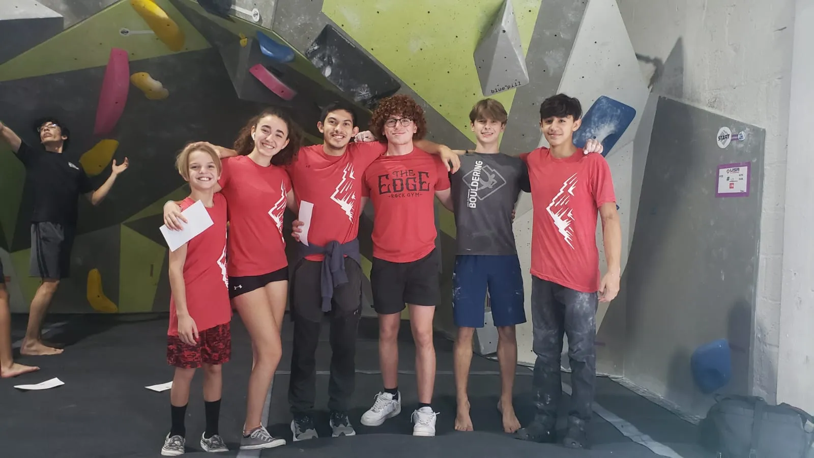 Members of Team Edge Miami's competitive youth climbing club along with their coach.