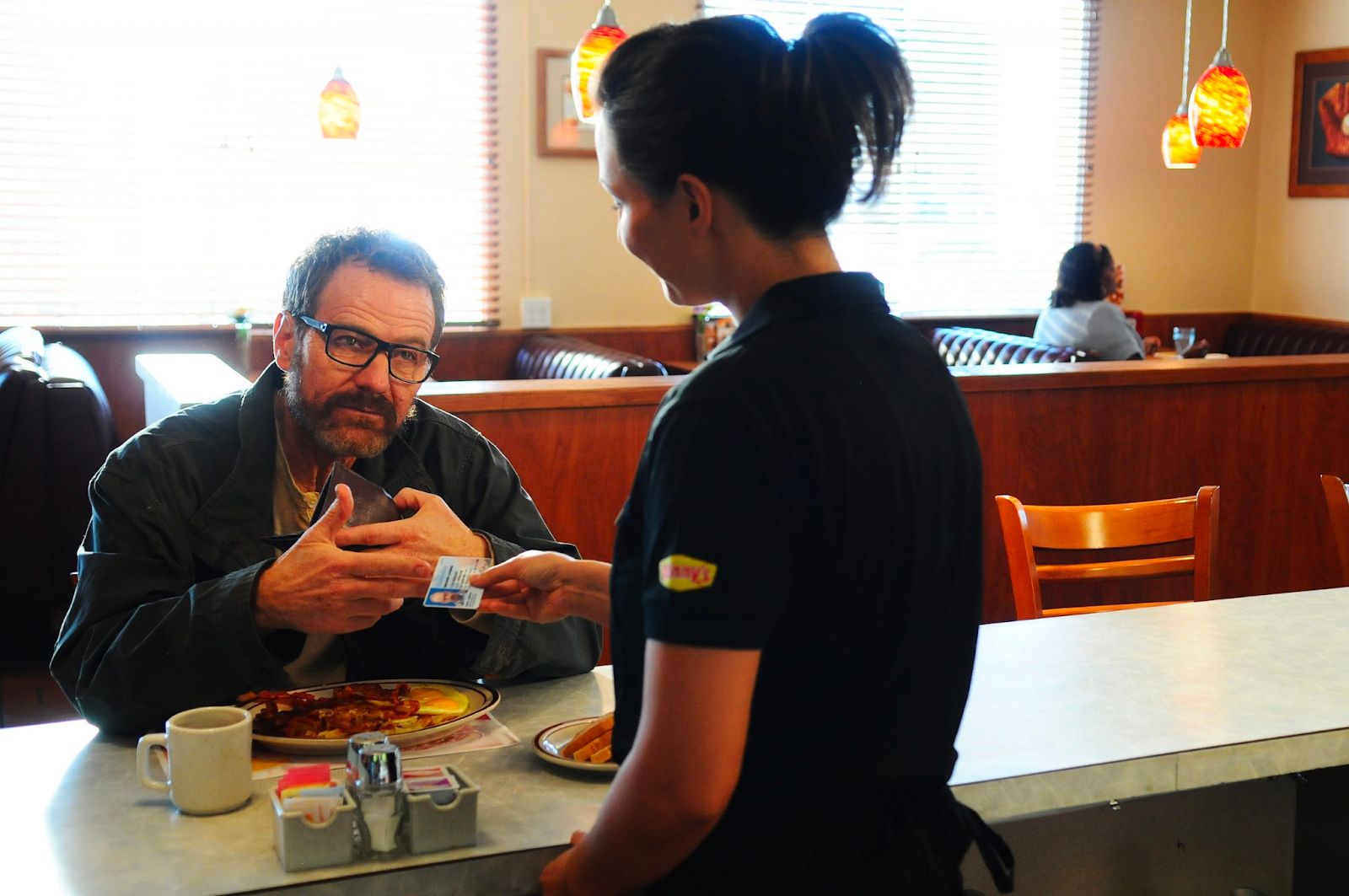 Breaking Bad lead Walter White speaks to a waitress at Denny's