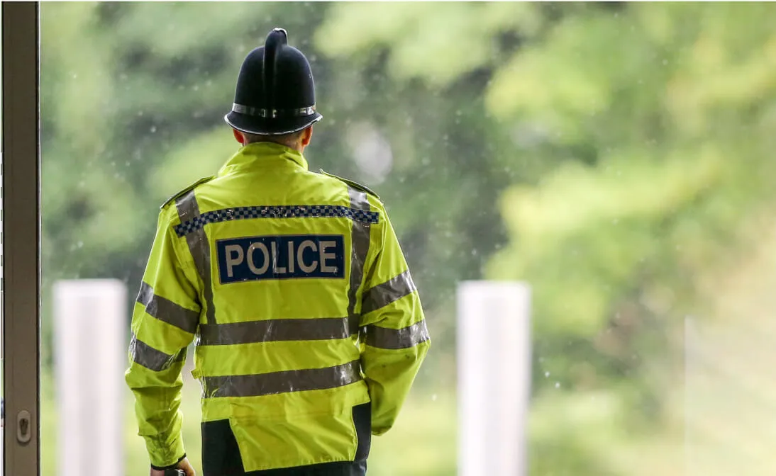 One Police Officer behind view