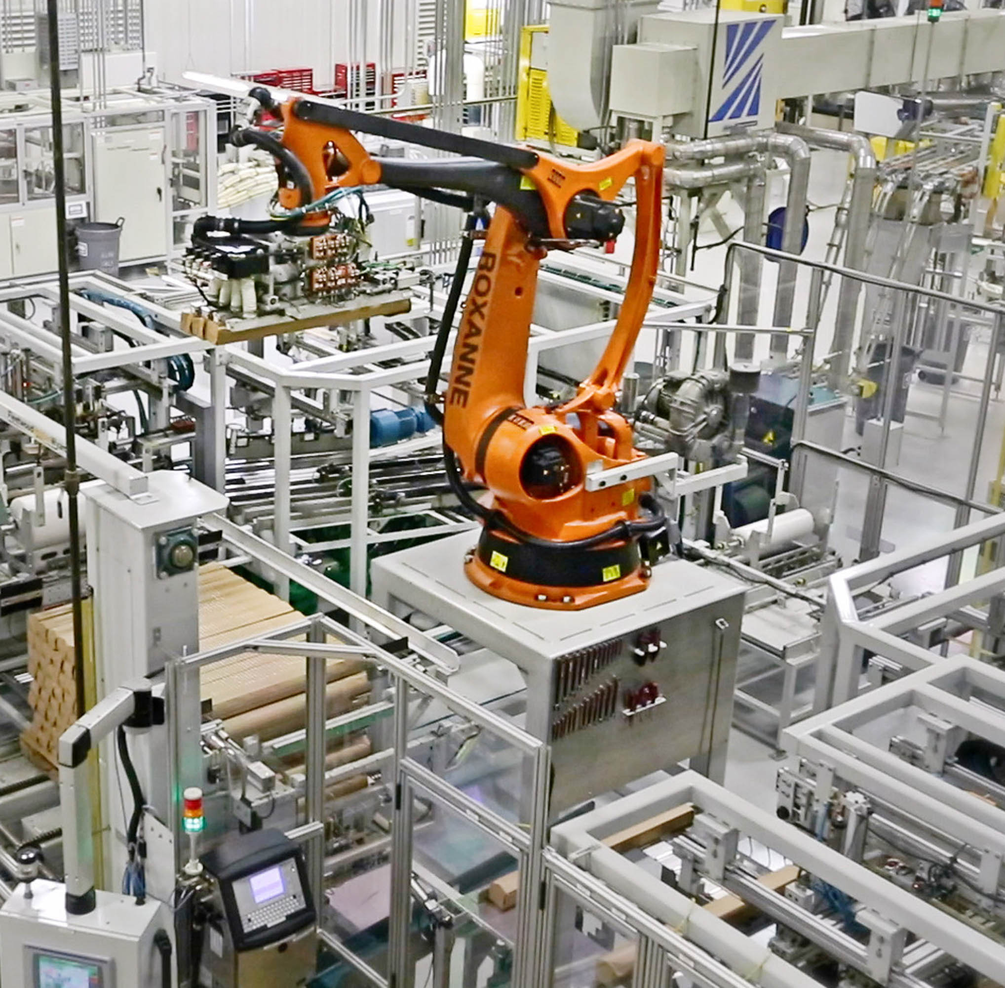 a robotic arm working in a manufacturing plant