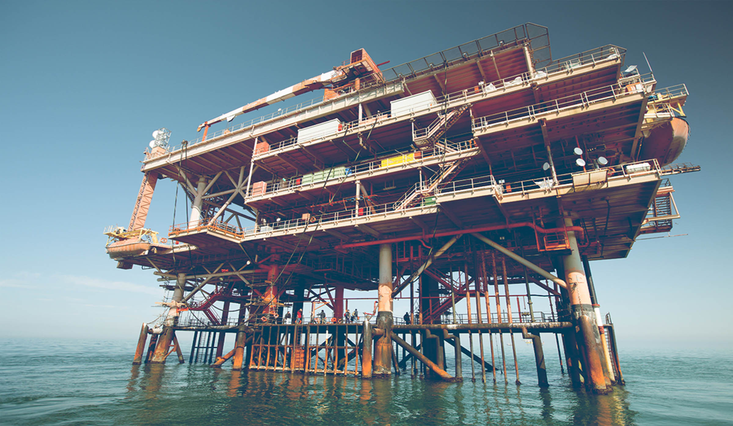 a low wide shot of an oil rig