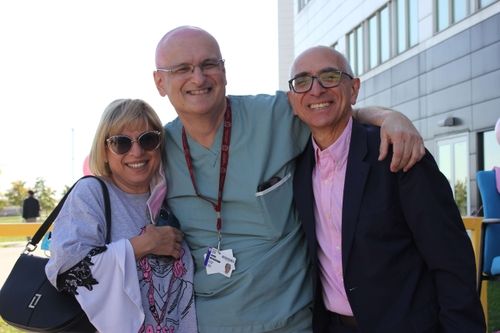 Image of three people hugging