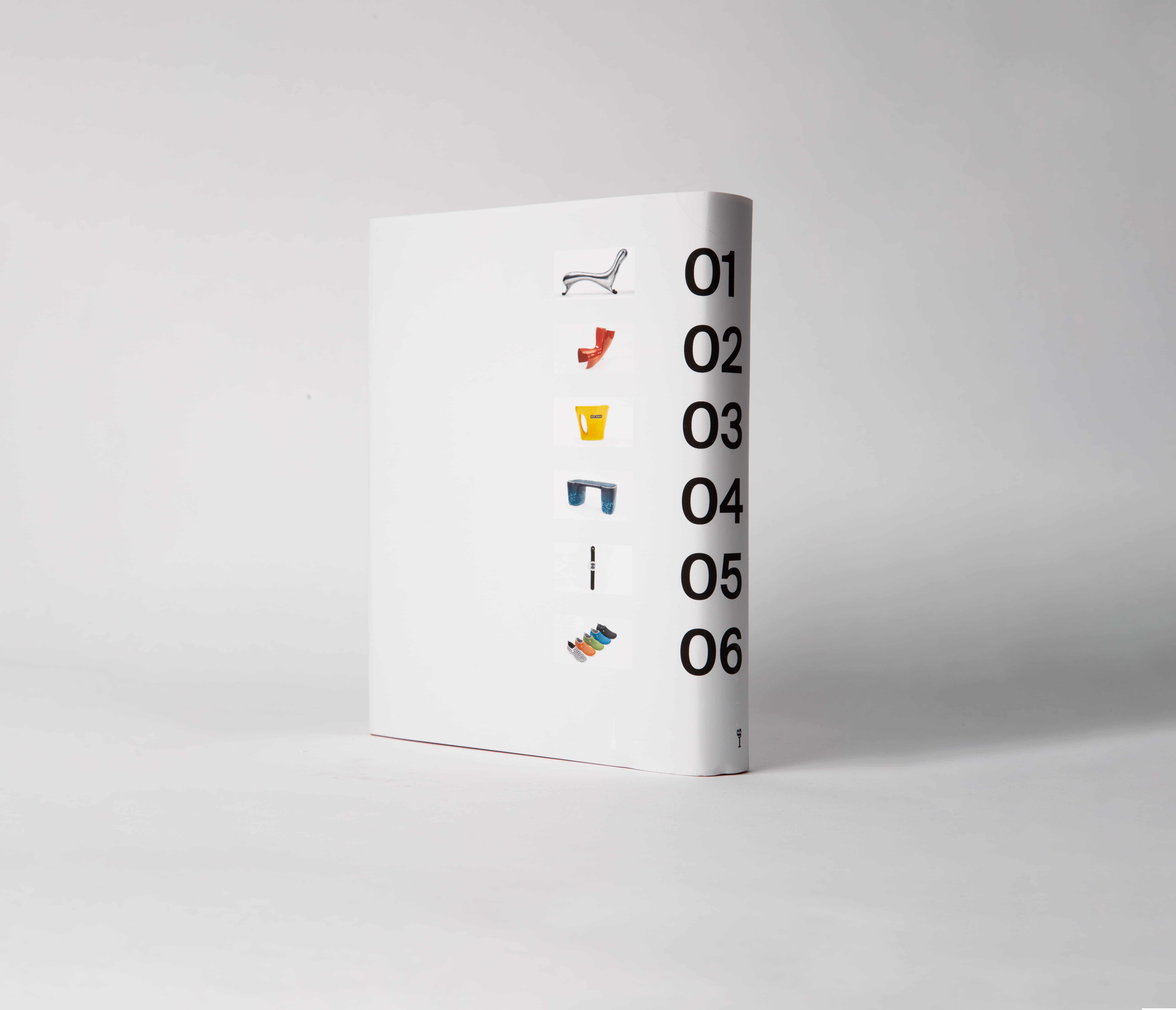 The back view hardcover book. The cover has 6 images with large black numbers.