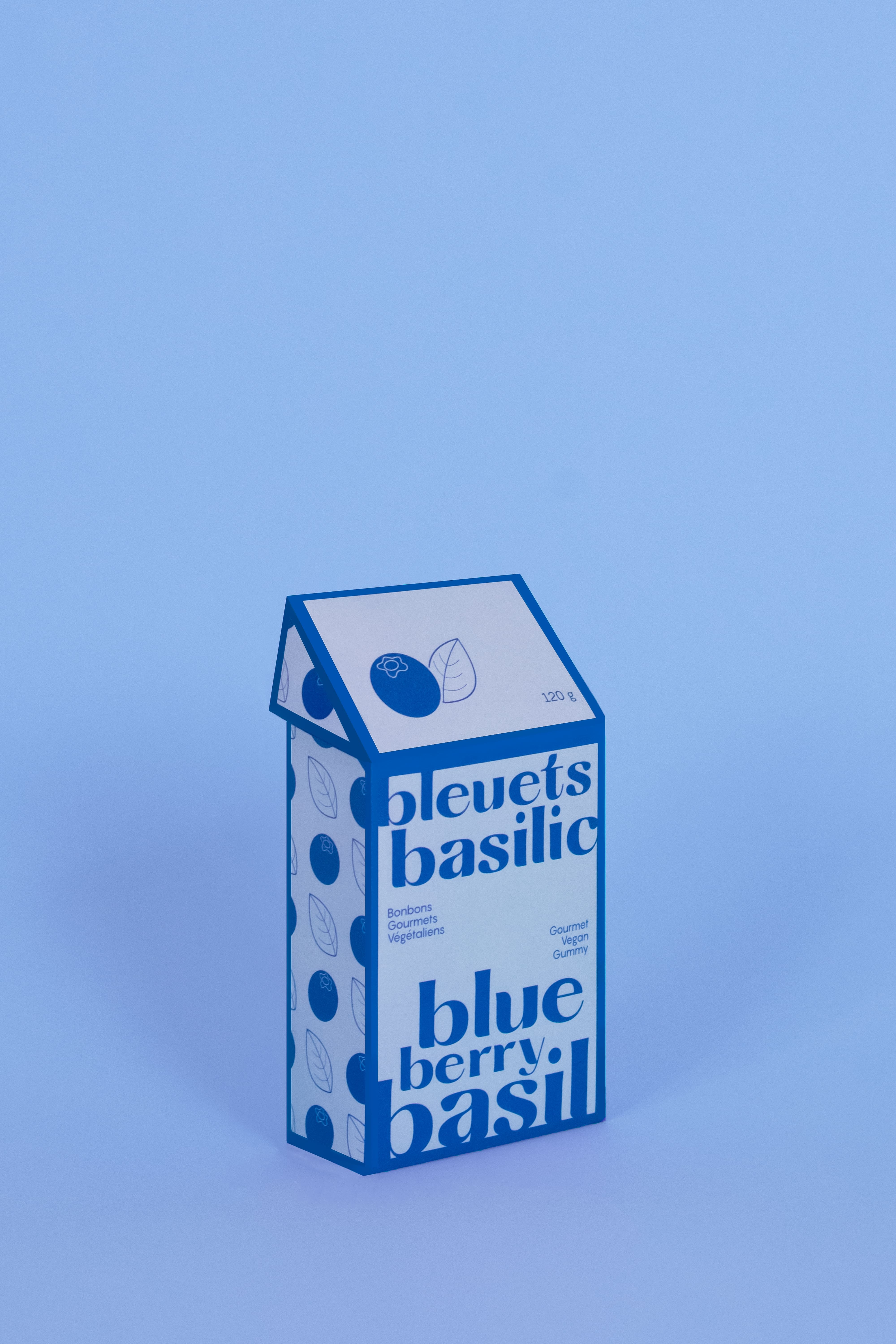 A blue candy package on a light blue background.
