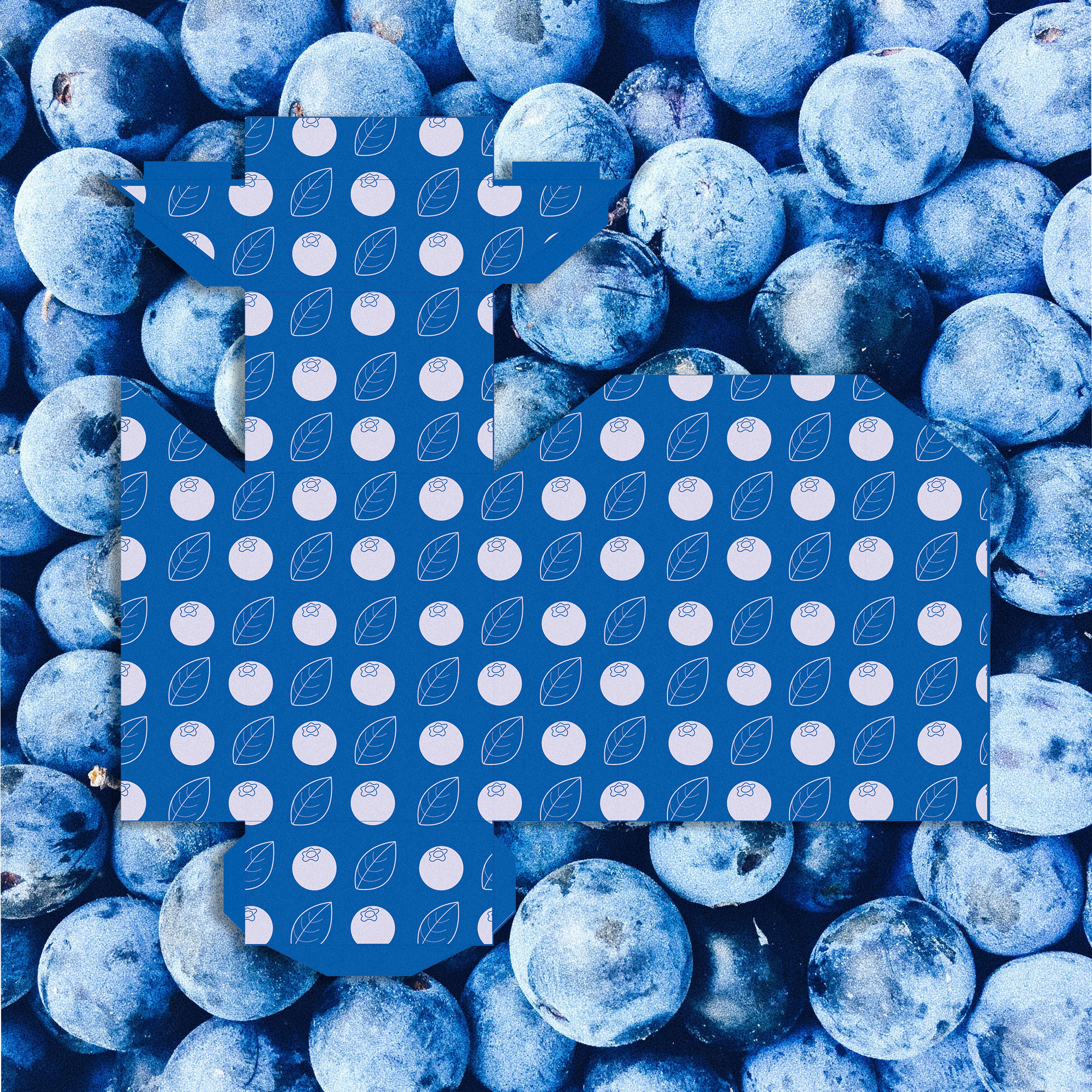 A blue candy package on a picture of blueberries.